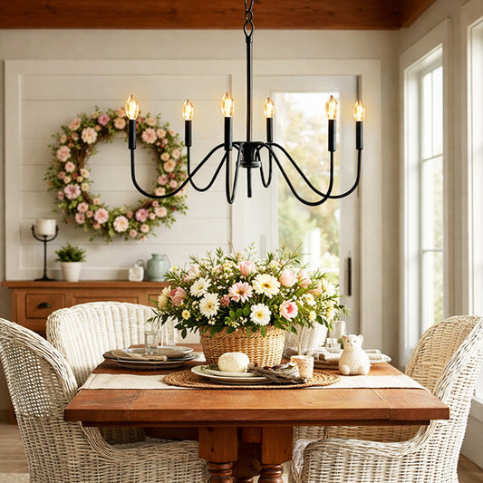 Dining room with a wooden table, floral centerpiece, and decorative wreath on the wall.