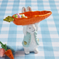 bunny holding carrot candy dish